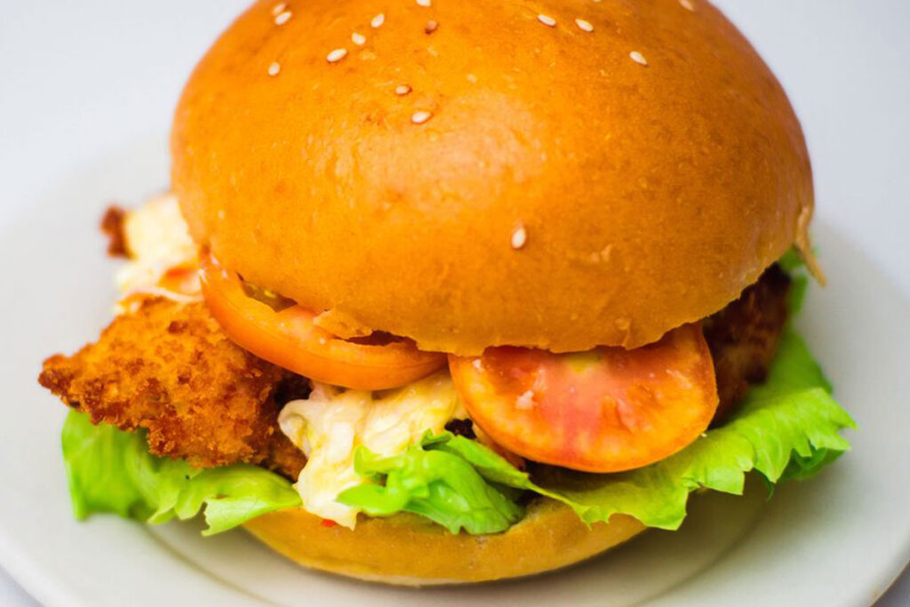 Crispy chicken fillet sandwich with golden-fried chicken breast, crispy on the outside, juicy on the inside