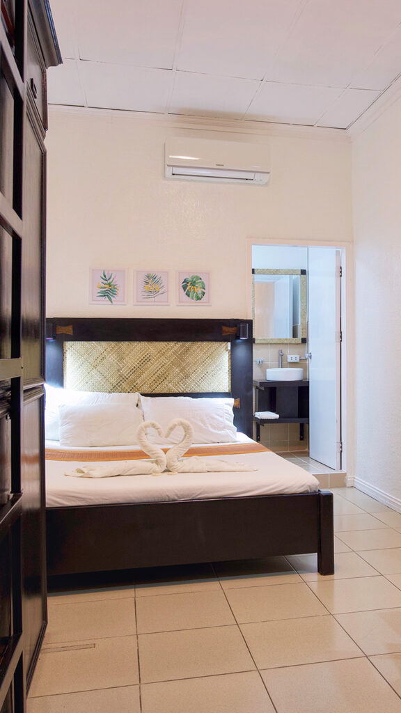 Cozy guest room at IDEA Café & Pension House with inviting ambiance